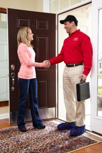 hvac technician greeting a homeowner