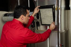 technician replacing air filter