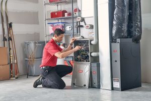 The South Central PA Pros of HVAC Preventive Maintenance | HVAC technician doing preventative maintenance 